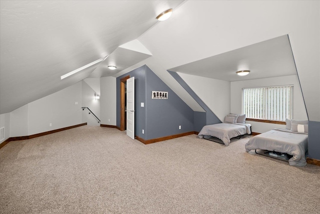 bedroom with lofted ceiling and carpet flooring