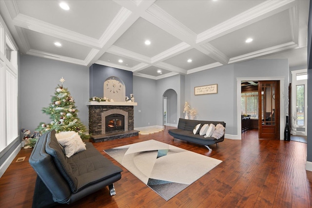 living room with beamed ceiling, coffered ceiling, a fireplace, and dark hardwood / wood-style floors