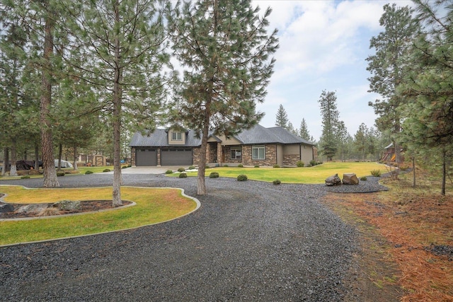 view of front of home featuring a garage and a front yard