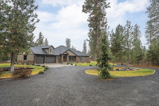 craftsman house with a garage and a front yard