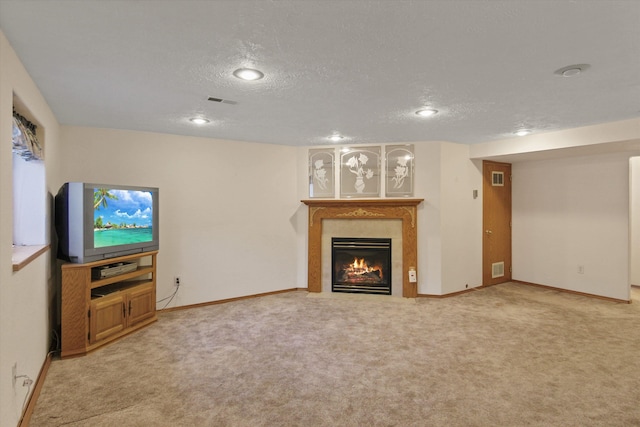 living room with carpet and a textured ceiling