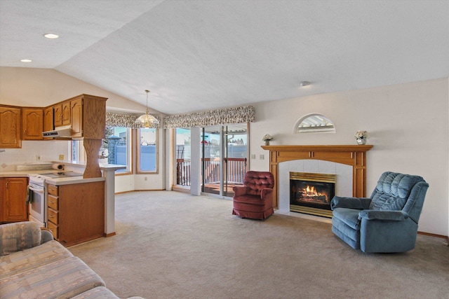 carpeted living room featuring lofted ceiling and a fireplace