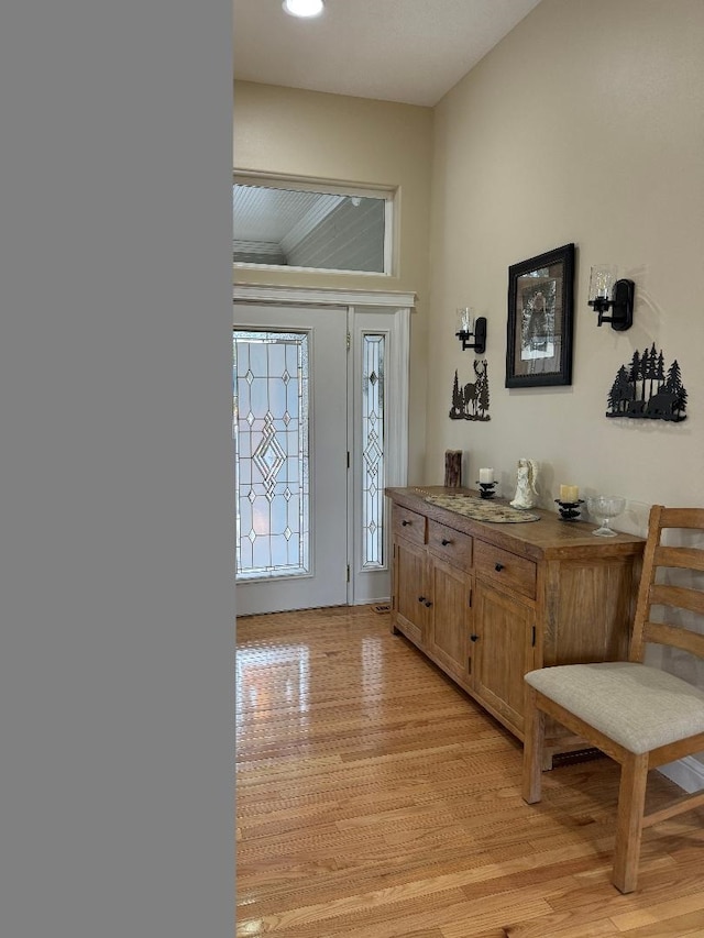 foyer with light hardwood / wood-style floors