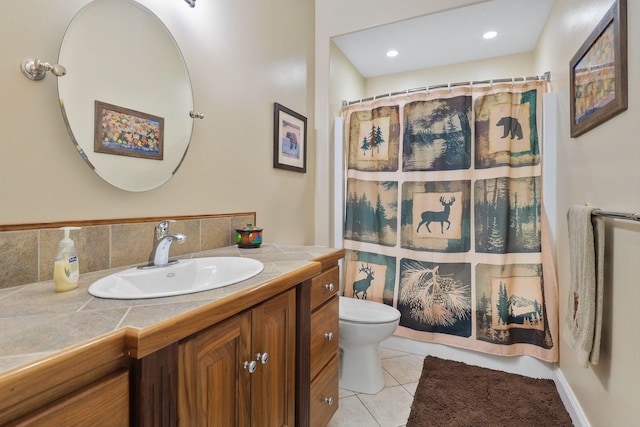 bathroom with tasteful backsplash, vanity, toilet, tile patterned floors, and a shower with curtain