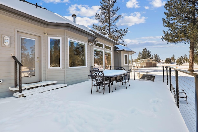 view of snow covered deck