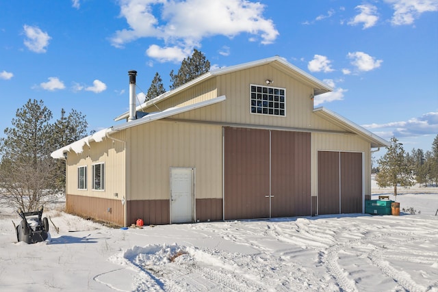 view of snow covered garage