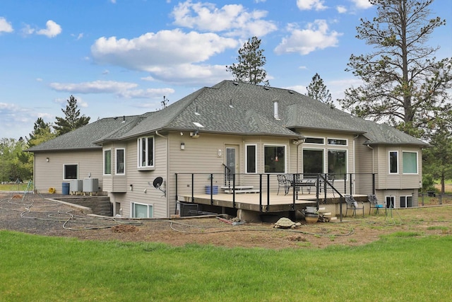 6919 E Spangle-Waverly Rd, Spangle, WA 99031 - back of house featuring a deck, roof with shingles, a yard, and central AC unit