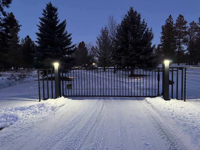 view of snow covered gate