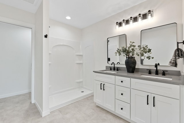 bathroom with vanity and walk in shower