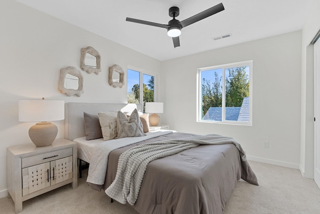 carpeted bedroom featuring ceiling fan