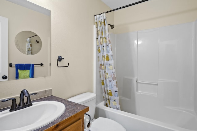 full bathroom with vanity, shower / bath combo, and toilet