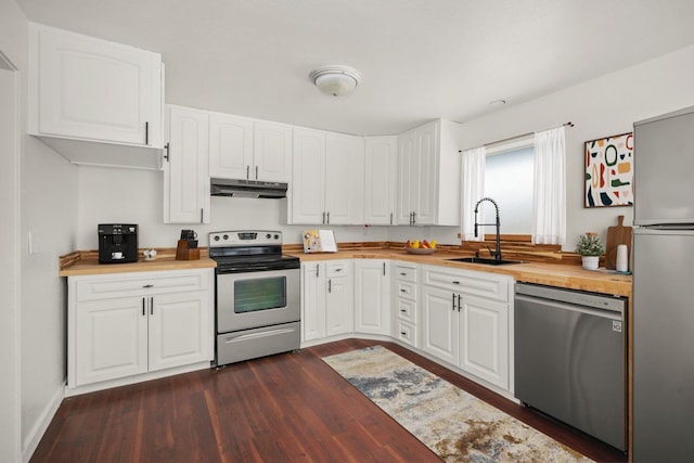 kitchen featuring sink, white cabinetry, stainless steel appliances, dark hardwood / wood-style floors, and wood counters