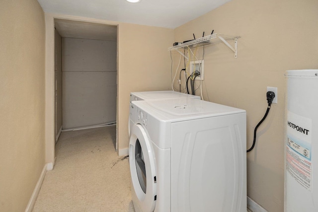 washroom featuring washing machine and dryer and water heater