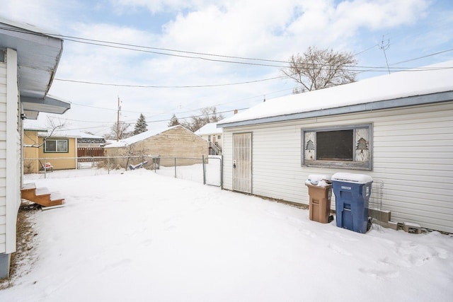 view of yard layered in snow