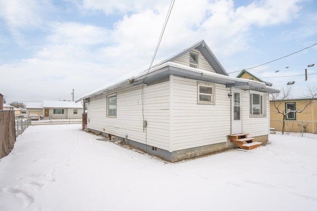 view of snow covered house