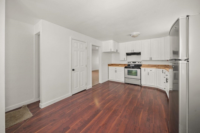 kitchen featuring dark wood-type flooring, stainless steel appliances, butcher block countertops, and white cabinets