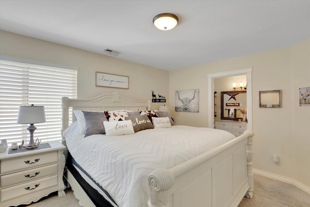 bedroom featuring light carpet