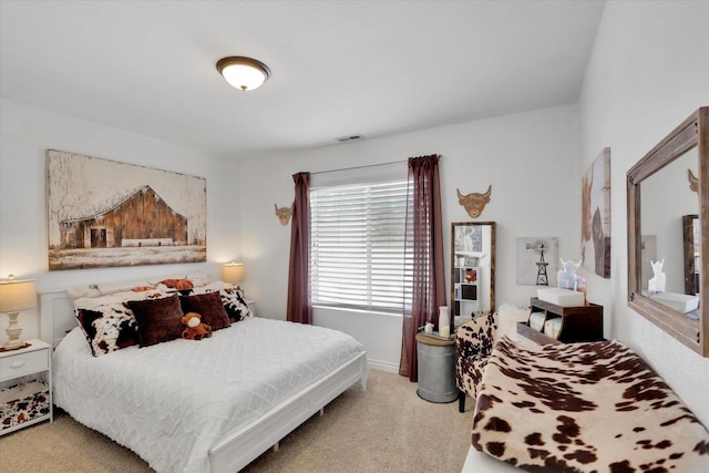 bedroom with light carpet