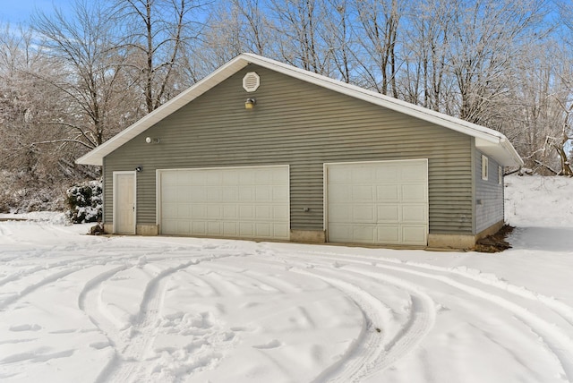 view of snow covered garage