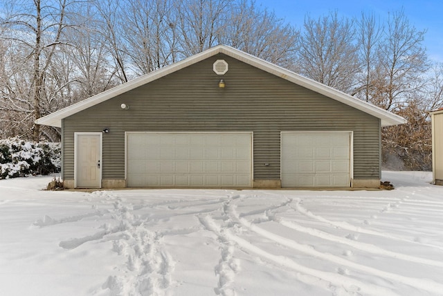 view of snow covered garage