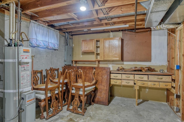 basement featuring electric panel and secured water heater