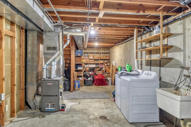 basement with independent washer and dryer and sink