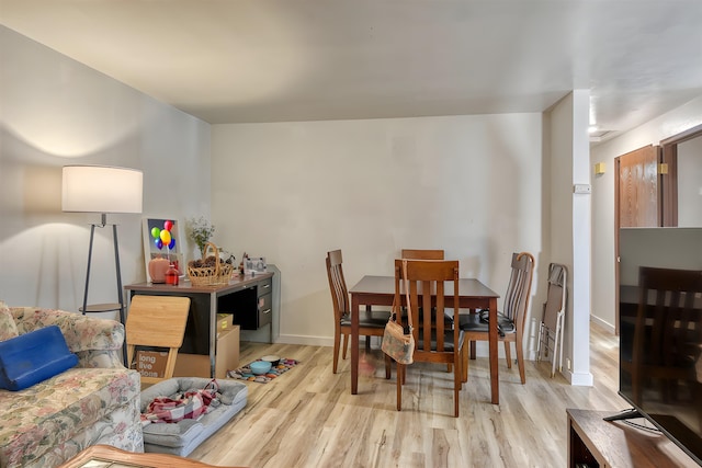 dining room featuring light wood-type flooring