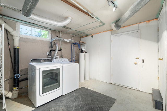 laundry area with washing machine and dryer