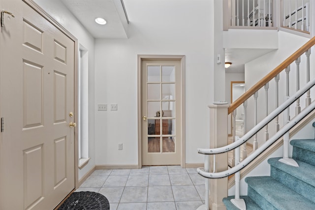 foyer with light tile patterned floors