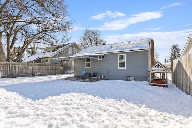 view of snow covered house