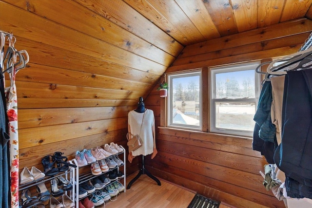 walk in closet featuring lofted ceiling and hardwood / wood-style floors