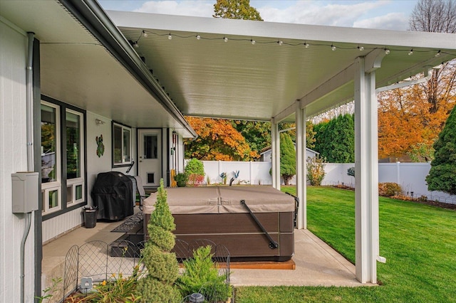 view of patio featuring a grill and a hot tub