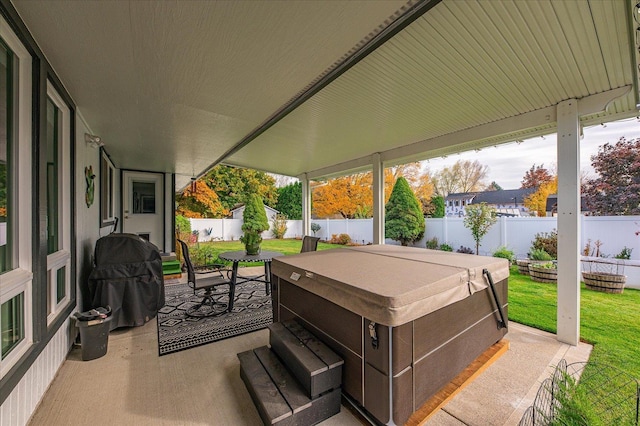 view of patio / terrace featuring grilling area and a hot tub