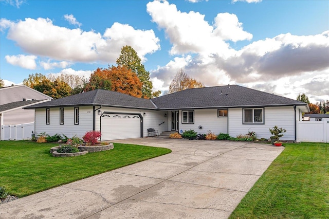 ranch-style house featuring a garage and a front lawn