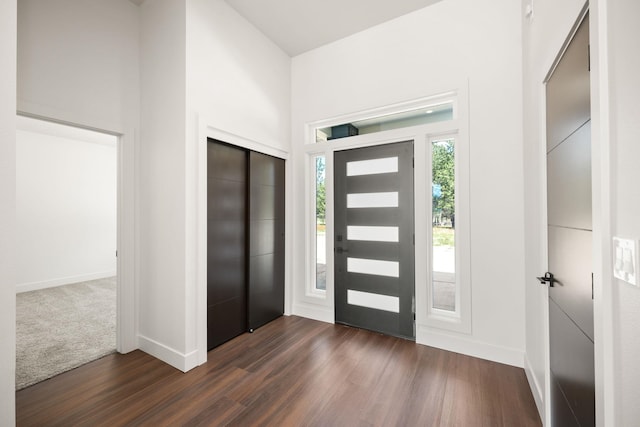 foyer featuring elevator and dark hardwood / wood-style flooring