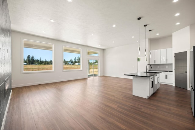 914 E Deer Park-Milan Rd, Deer Park, WA 99006 - kitchen with dark countertops, open floor plan, an island with sink, recessed lighting, and a sink