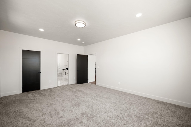 914 E Deer Park-Milan Rd, Deer Park, WA 99006 - unfurnished bedroom with carpet floors, recessed lighting, baseboards, and ensuite bath