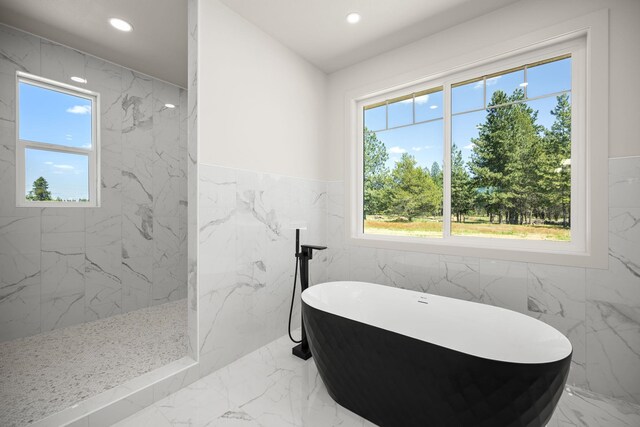 914 E Deer Park-Milan Rd, Deer Park, WA 99006 - full bath featuring marble tiled floors, a soaking tub, recessed lighting, a marble finish shower, and tile walls