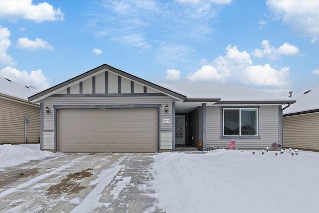 single story home featuring a garage