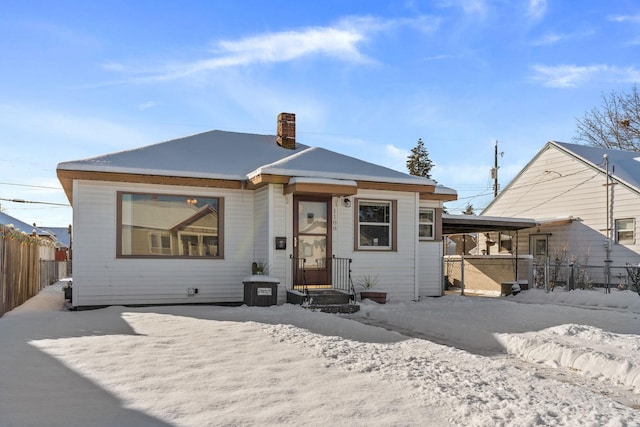 view of snow covered house