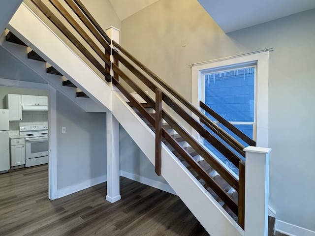 stairway with hardwood / wood-style flooring