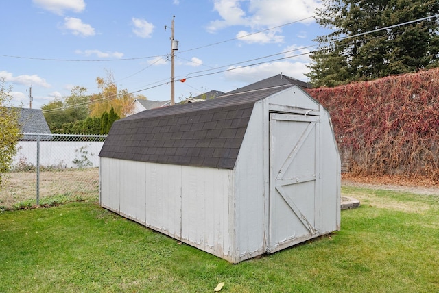 view of outdoor structure featuring a yard