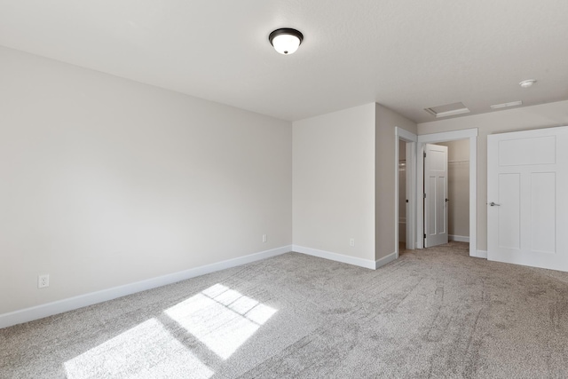 28411 N Milan Rd, Chattaroy, WA 99003 - unfurnished bedroom with light carpet, a walk in closet, and a closet