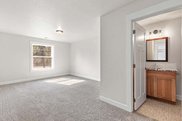 28411 N Milan Rd, Chattaroy, WA 99003 - carpeted empty room featuring sink and a textured ceiling