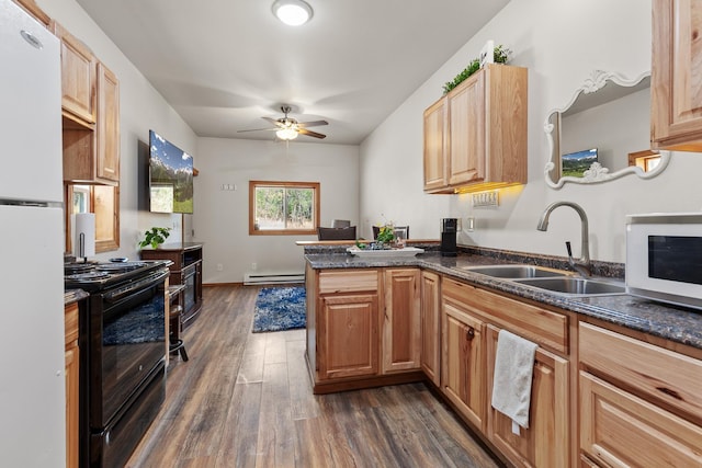 28411 N Milan Rd, Chattaroy, WA 99003 - kitchen featuring sink, white appliances, dark wood-type flooring, a baseboard radiator, and kitchen peninsula