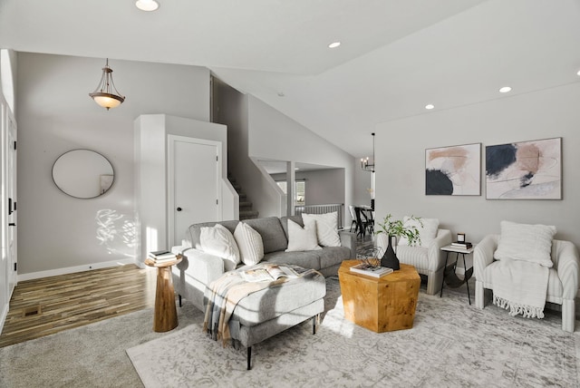 living room featuring hardwood / wood-style flooring and high vaulted ceiling