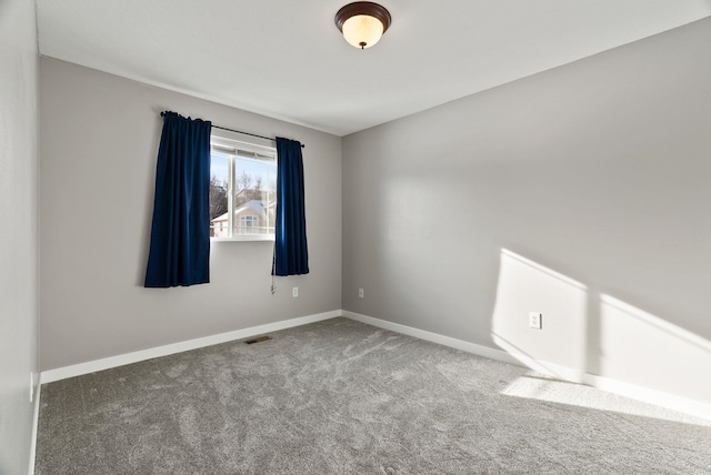 unfurnished room with carpet floors