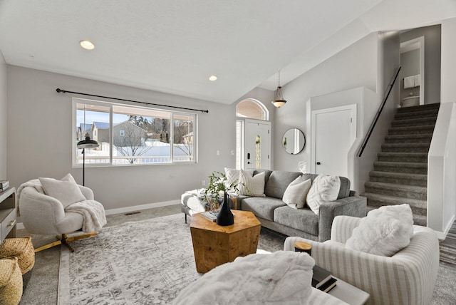 living room with vaulted ceiling and carpet