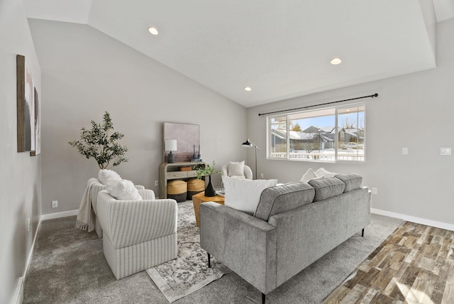 living room featuring vaulted ceiling and wood-type flooring