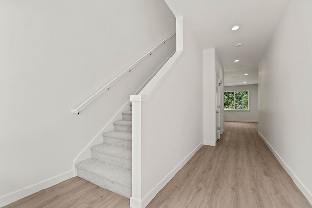 stairway with wood-type flooring